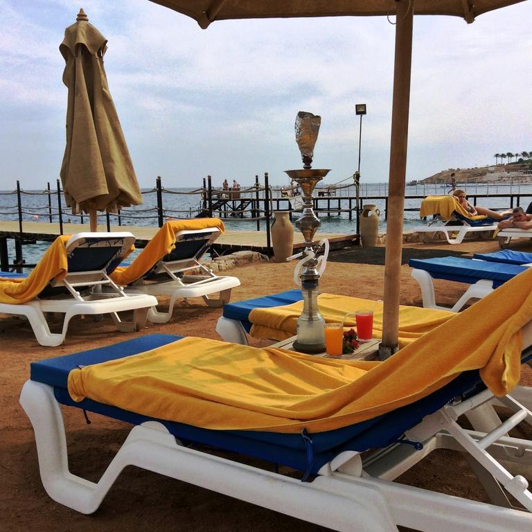 Xperience Sea Breeze Resort (Adults Only) Sharm el Sheikh Esterno foto A hookah at a beach resort in Egypt