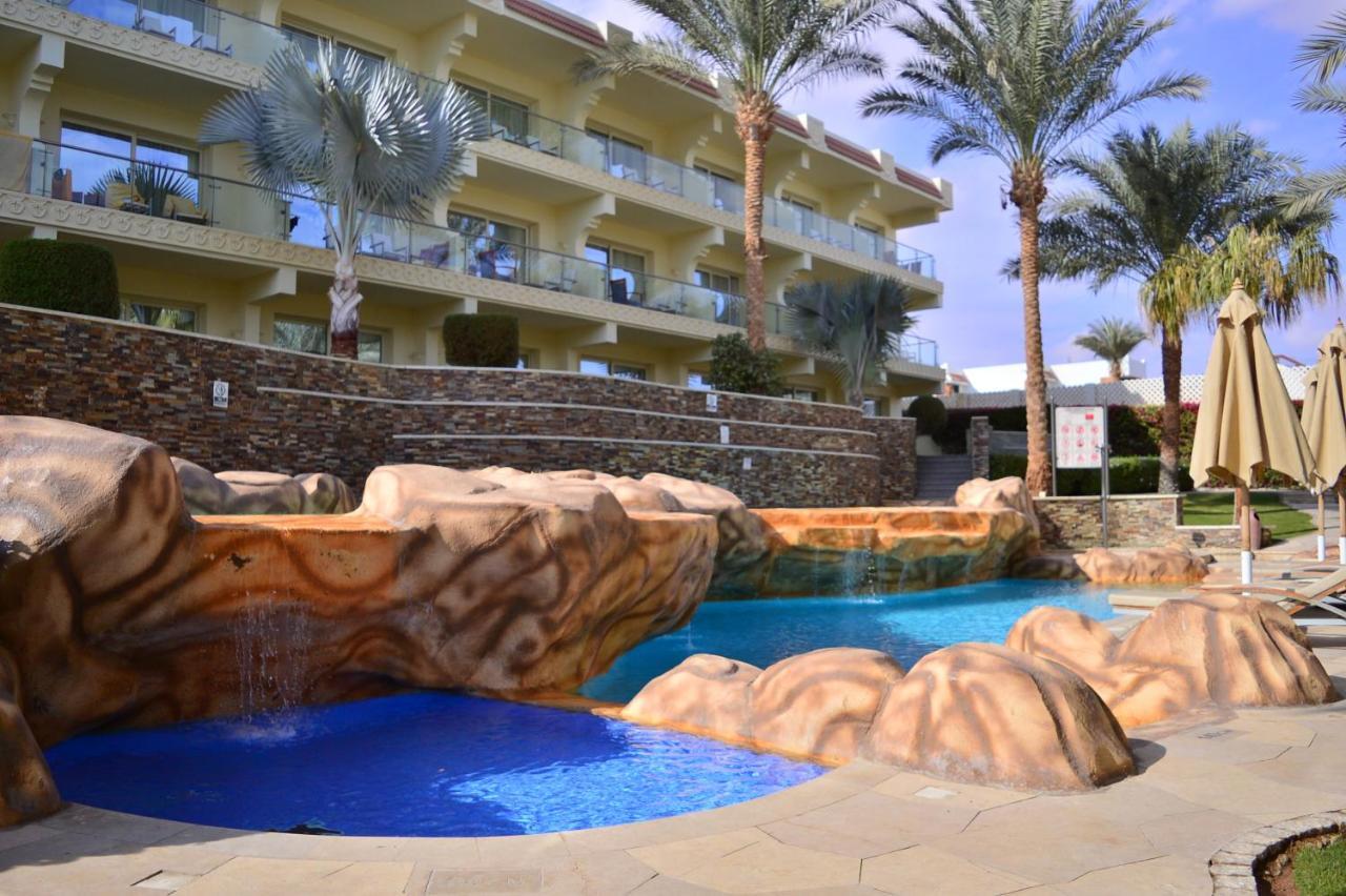 Xperience Sea Breeze Resort (Adults Only) Sharm el Sheikh Esterno foto The pool at the Hilton Sharm El Sheikh