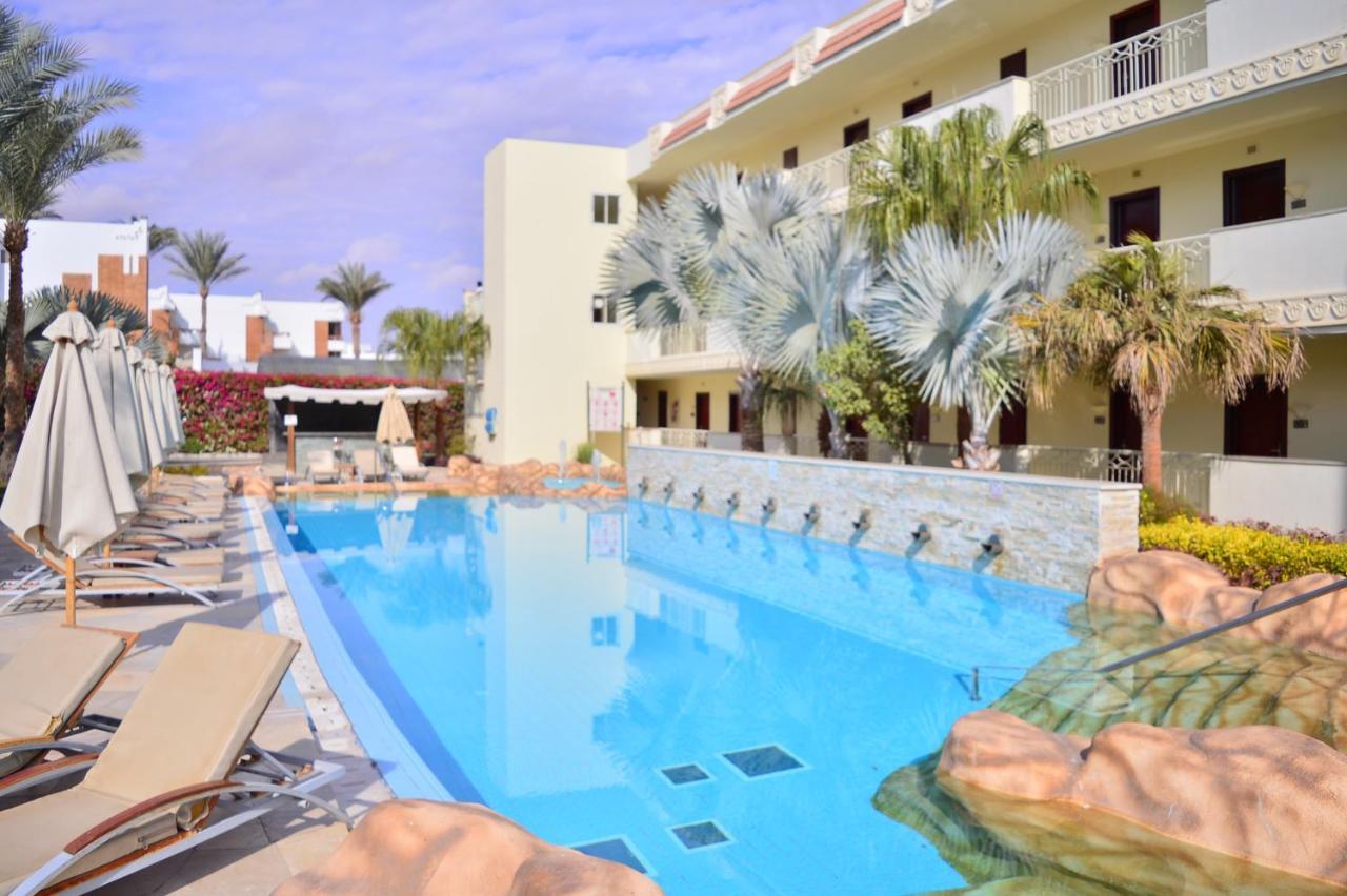 Xperience Sea Breeze Resort (Adults Only) Sharm el Sheikh Esterno foto A swimming pool at a hotel in Egypt